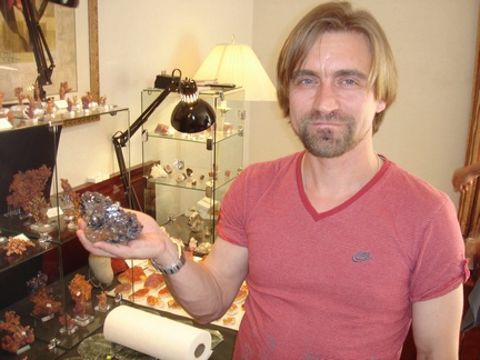 Mikhail Anosov of Russian Minerals posing with Cuprite