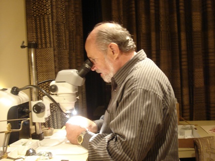 Marshall, carefully studying the Tsumebite from Mandy's collection